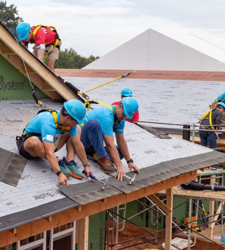Volunteer's working on a house