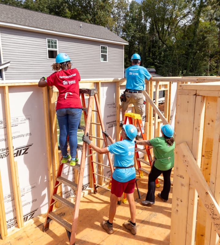 Habitat for Humanity volunteer building a house