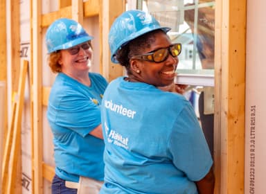 Women's Build volunteers building a house