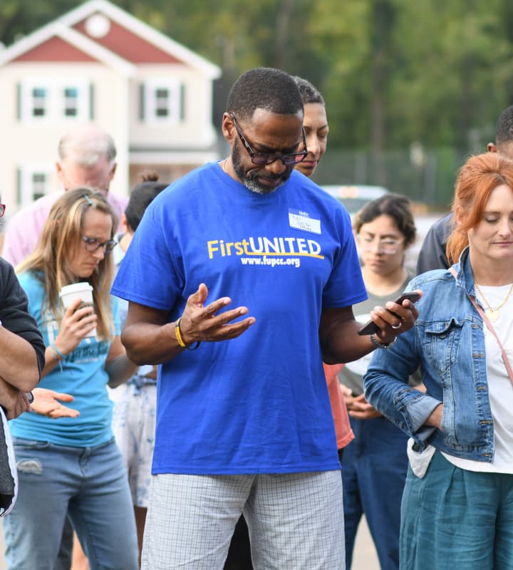 Habitat for Humanity volunteers praying