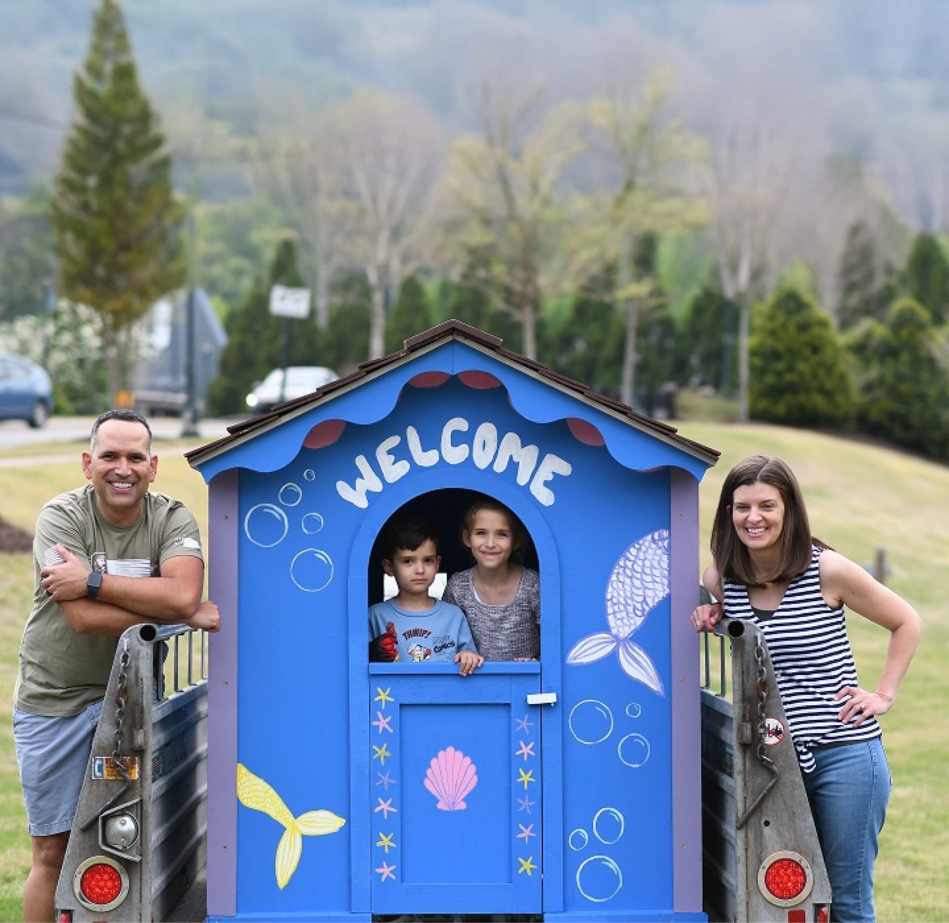 Family building a child's Playhouse