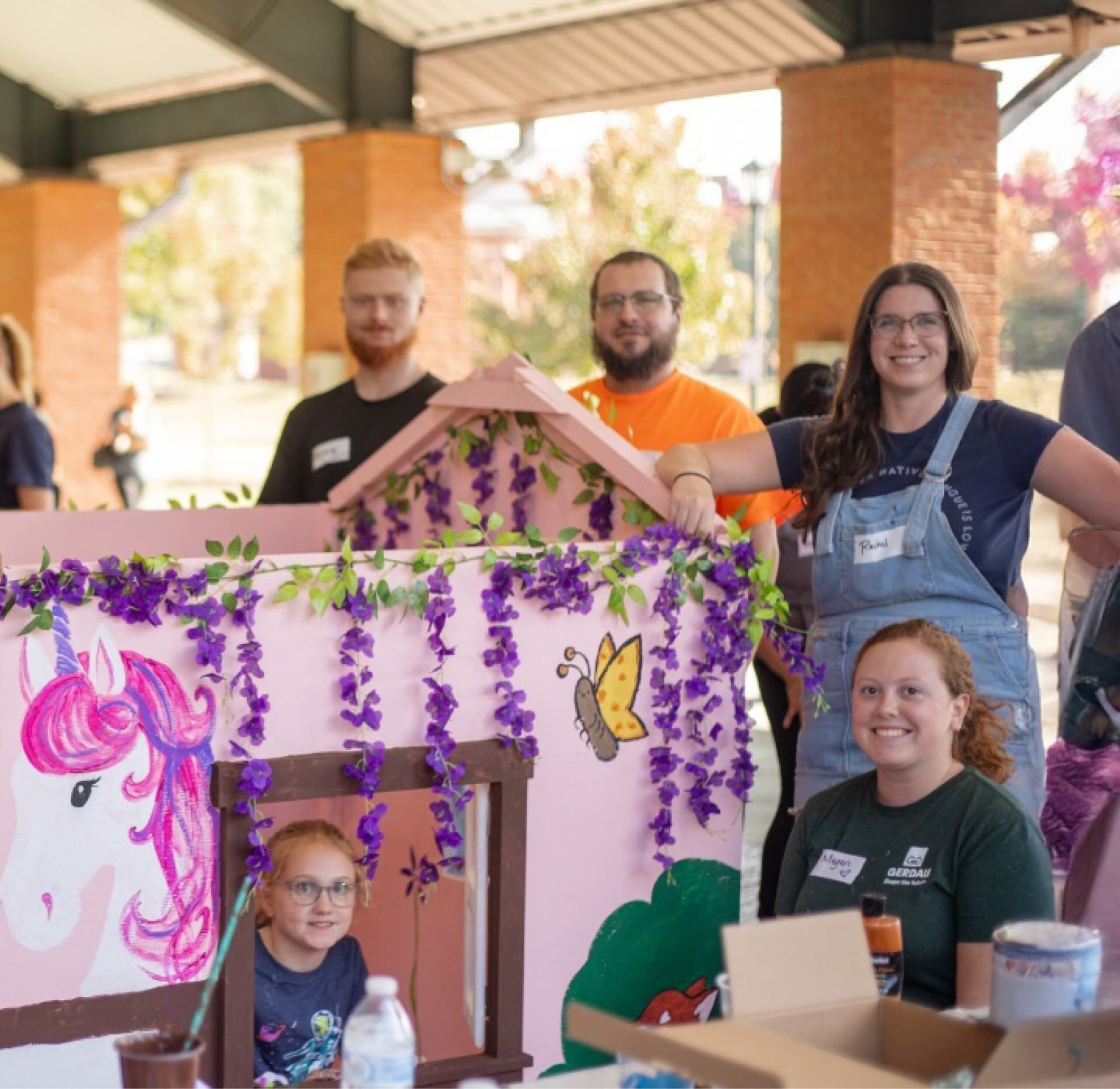 Team building a child's Playhouse