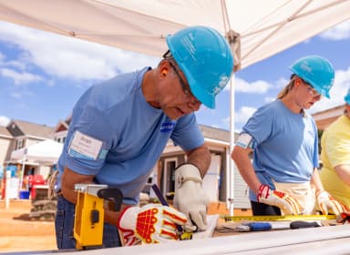 Habitat for Humanity volunteer making plans