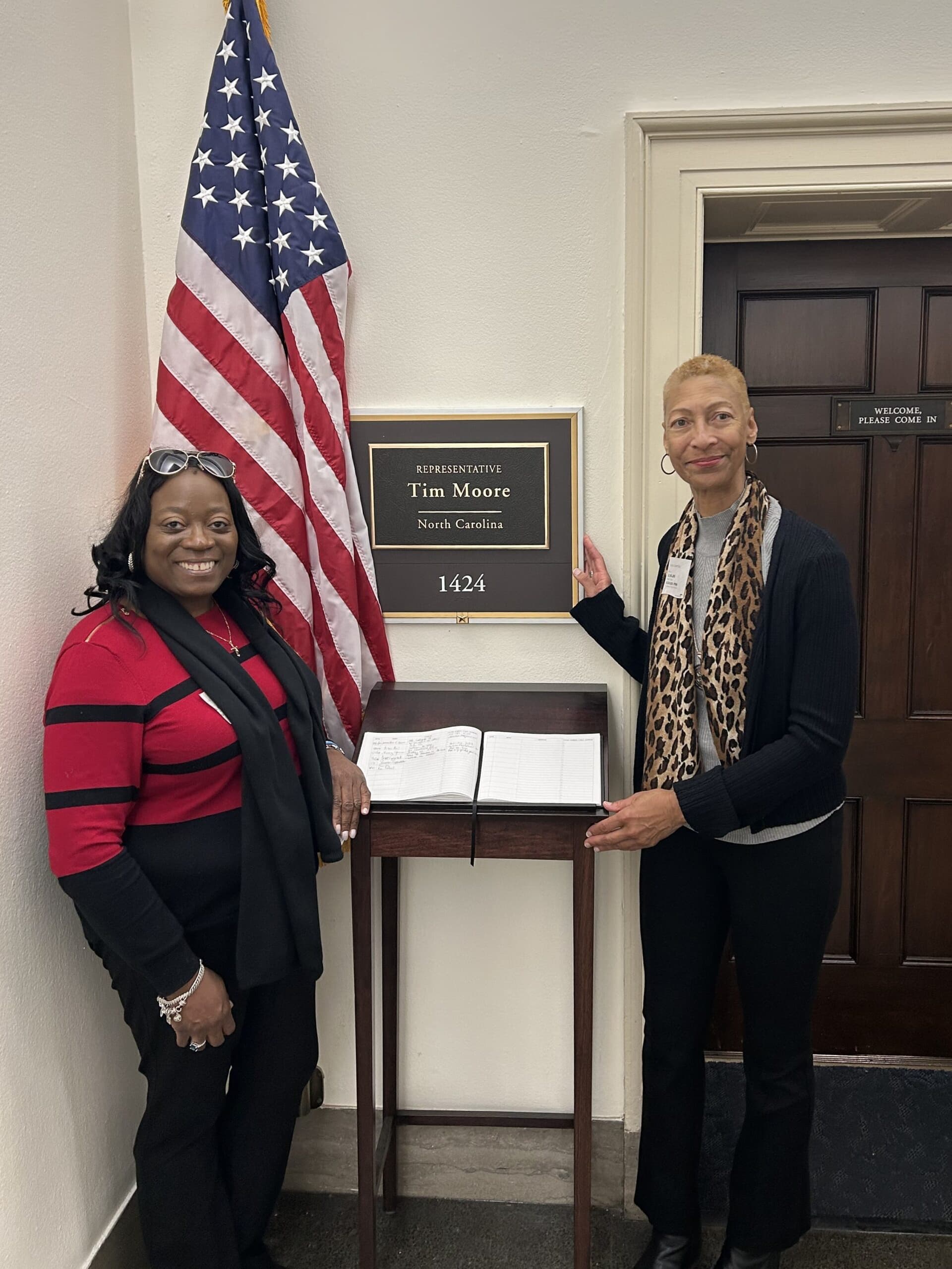 Two women standing outside of Representative Tim Moore's office in Washington, D.C.